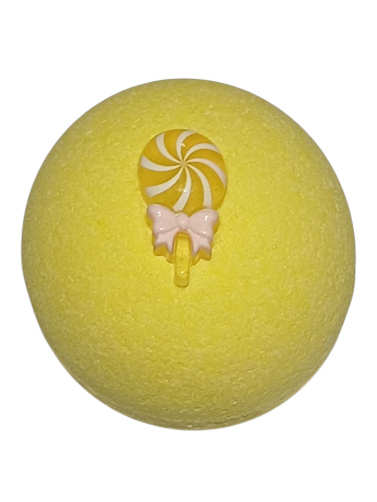 Passionfruit scented yellow bath bomb, with a lolly pop decoration on top