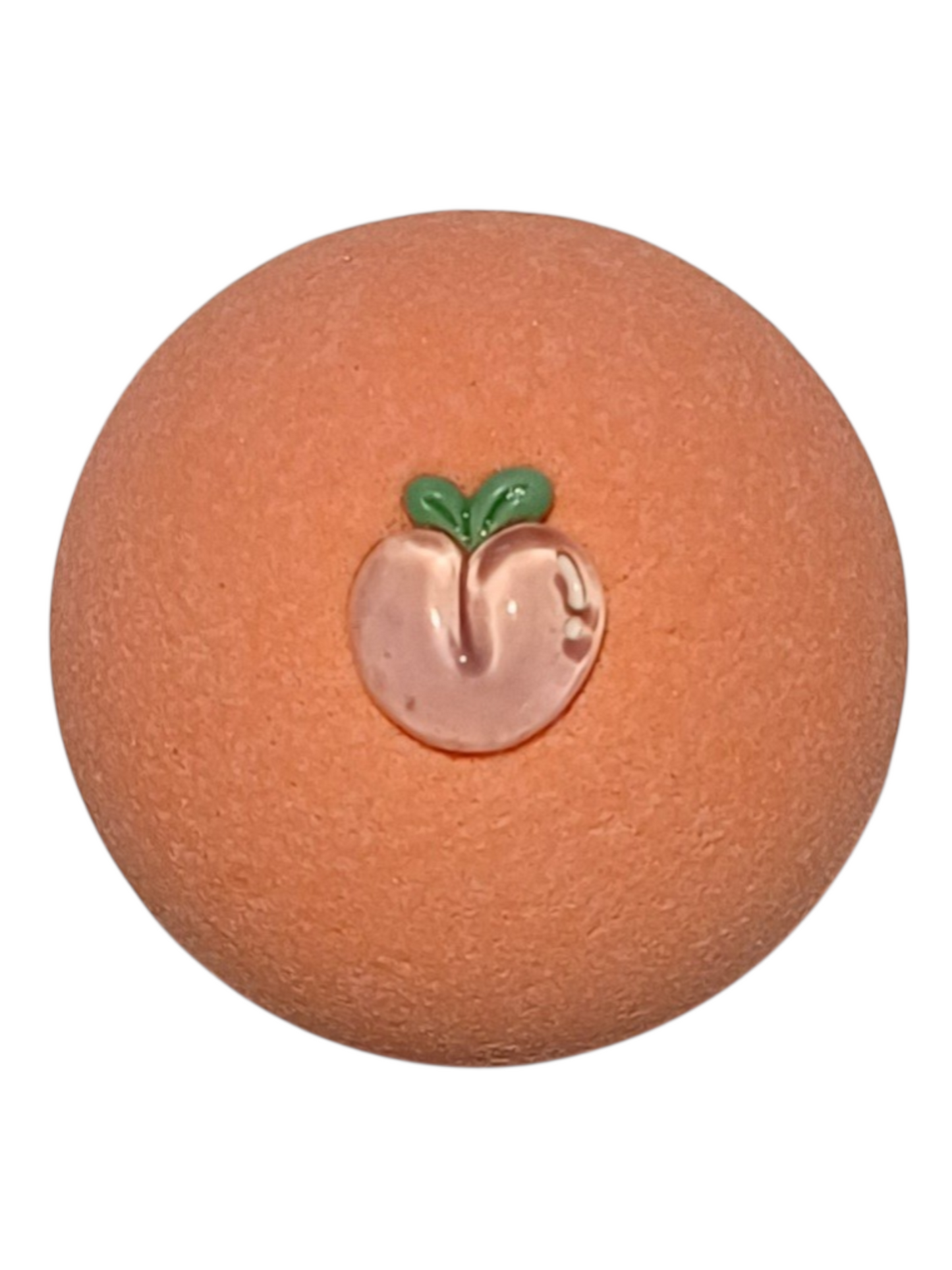 Peach scented bath bomb with a peach-shaped charm