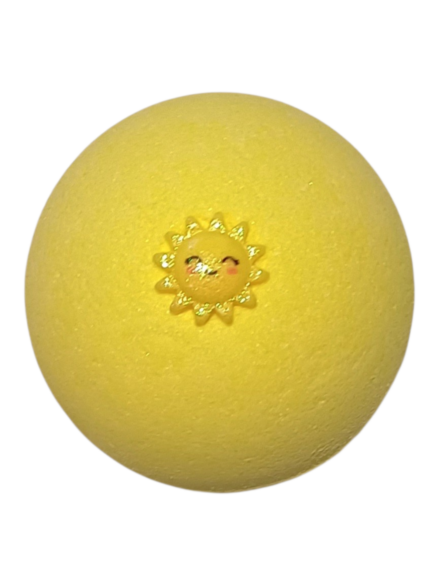 Yellow ball with a sun design on top