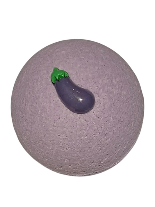 Purple bath bomb with an eggplant-shaped center.